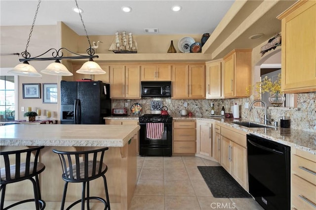 kitchen with black appliances, a sink, light brown cabinets, light tile patterned floors, and backsplash