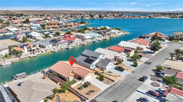 aerial view of residential area with a large body of water