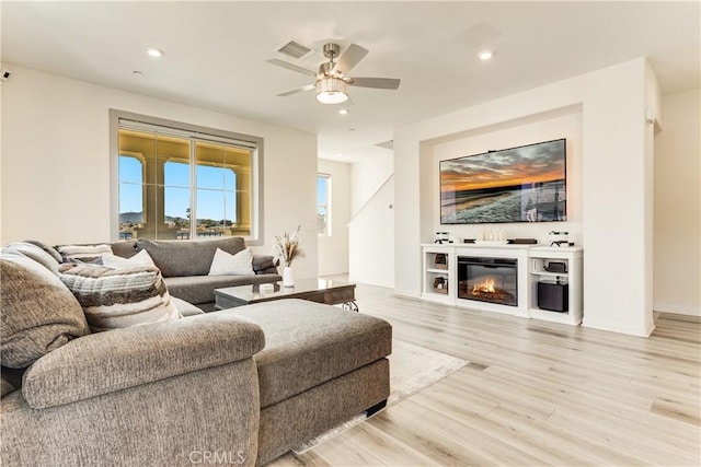1648 Fig Tree Way, Oceanside, CA 92056 - living area featuring light wood-style floors, a ceiling fan, recessed lighting, and a glass covered fireplace