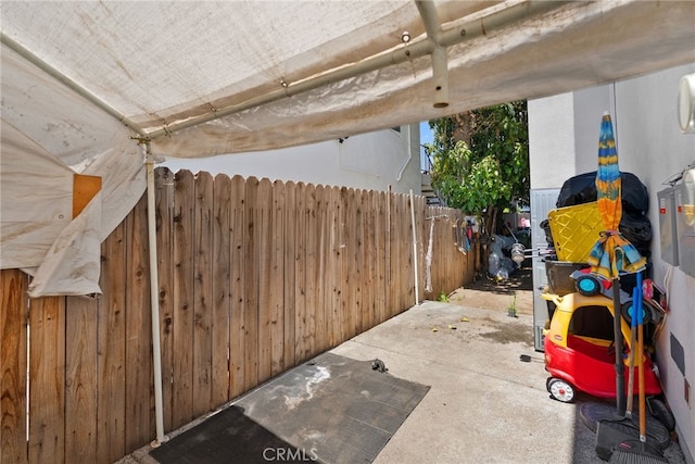 view of patio / terrace featuring fence