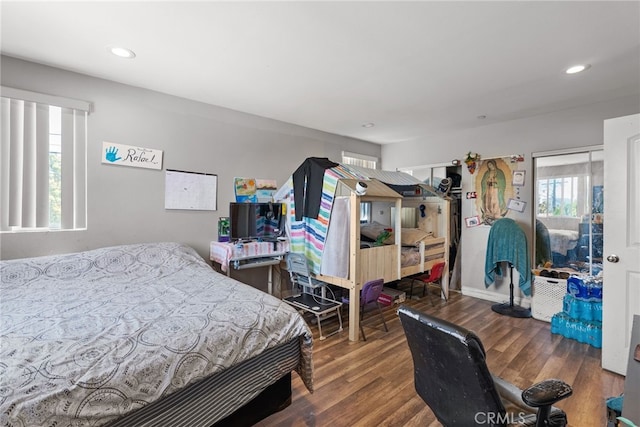 bedroom featuring wood finished floors and recessed lighting