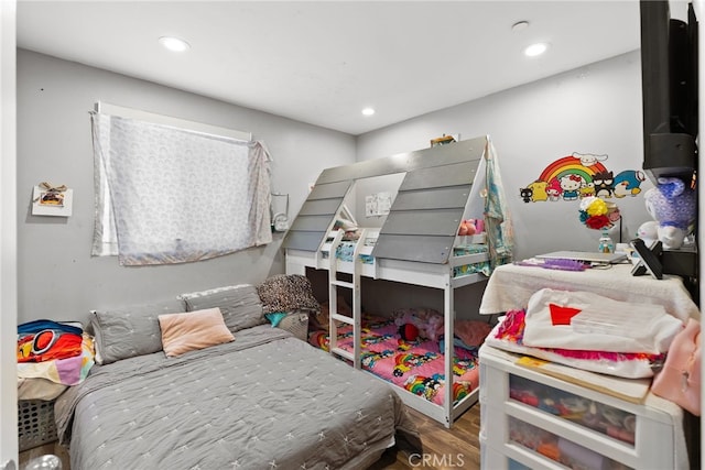 bedroom with wood finished floors and recessed lighting