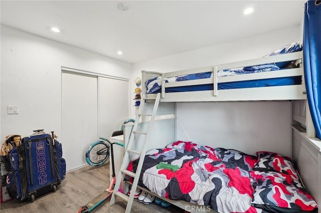 3322 W 66th St, Los Angeles, CA 90043 - bedroom featuring wood finished floors, recessed lighting, and a closet