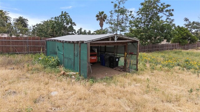 view of pole building with fence