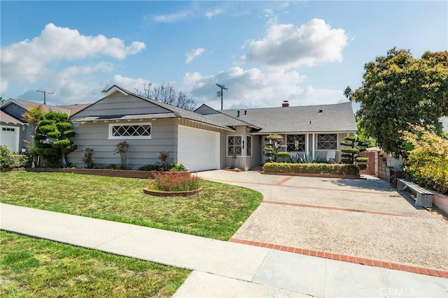 ranch-style home featuring a garage and driveway