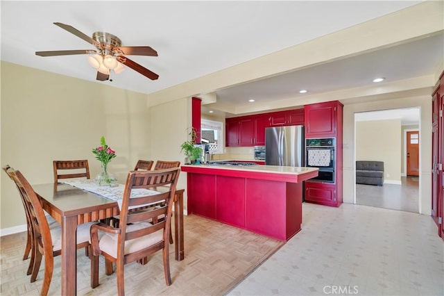 1961 W 187th Pl, Torrance, CA 90504 - kitchen with oven, freestanding refrigerator, a warming drawer, reddish brown cabinets, and recessed lighting