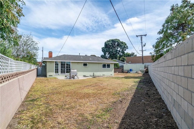 1961 W 187th Pl, Torrance, CA 90504 - back of property with stucco siding, a patio, and a chimney