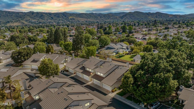 2451 Manet Ln, Simi Valley, CA 93063 - aerial overview of property's location featuring nearby suburban area and a mountain backdrop