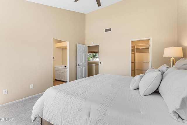 2451 Manet Ln, Simi Valley, CA 93063 - carpeted bedroom featuring high vaulted ceiling, a walk in closet, baseboards, ensuite bathroom, and a closet