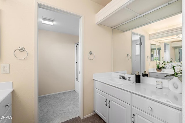 2451 Manet Ln, Simi Valley, CA 93063 - full bathroom with vanity, baseboards, and tile patterned floors