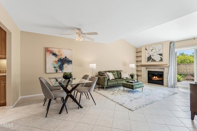 2451 Manet Ln, Simi Valley, CA 93063 - living area with a ceiling fan, light tile patterned floors, a tiled fireplace, and baseboards