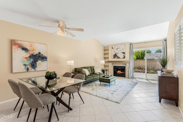 2451 Manet Ln, Simi Valley, CA 93063 - living area featuring light tile patterned floors, ceiling fan, a tile fireplace, and baseboards