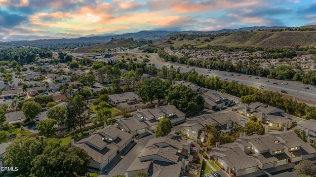 2451 Manet Ln, Simi Valley, CA 93063 - aerial view of property and surrounding area featuring nearby suburban area and a mountain backdrop