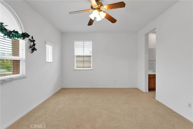 34113 Castle Pines Dr, Yucaipa, CA 92399 - spare room with light colored carpet and a ceiling fan