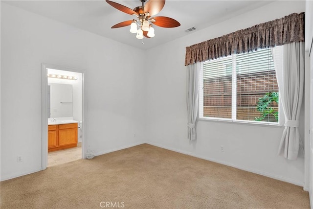 34113 Castle Pines Dr, Yucaipa, CA 92399 - unfurnished bedroom featuring light colored carpet, baseboards, ensuite bathroom, and ceiling fan