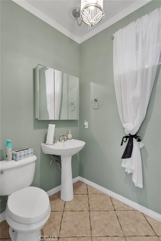 34113 Castle Pines Dr, Yucaipa, CA 92399 - half bathroom with toilet, tile patterned flooring, a chandelier, and baseboards