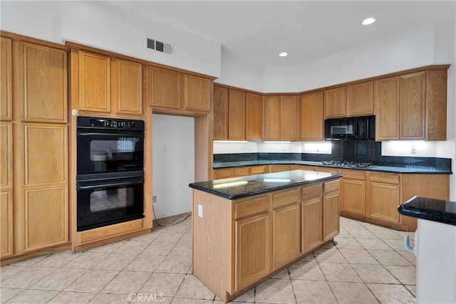 34113 Castle Pines Dr, Yucaipa, CA 92399 - kitchen with black appliances, light tile patterned flooring, a center island, dark stone counters, and recessed lighting