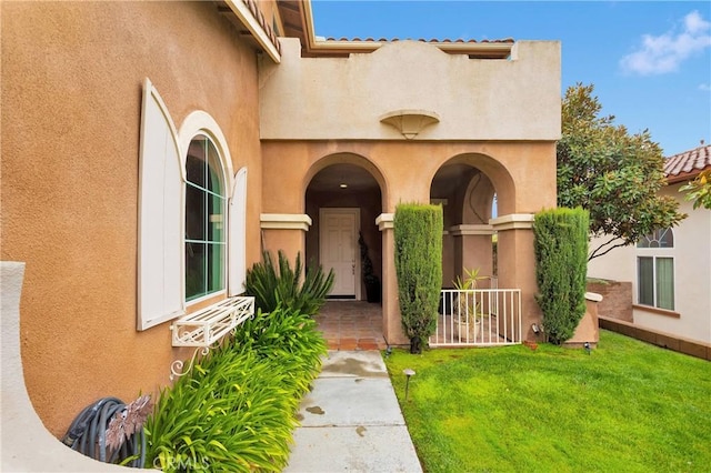34113 Castle Pines Dr, Yucaipa, CA 92399 - property entrance featuring stucco siding and a yard