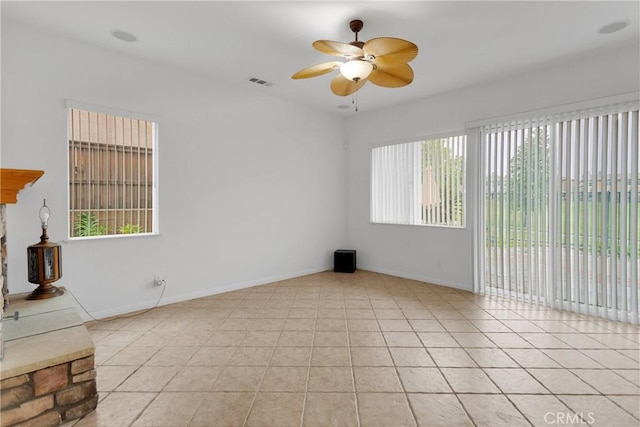 34113 Castle Pines Dr, Yucaipa, CA 92399 - empty room featuring a ceiling fan, baseboards, and light tile patterned floors