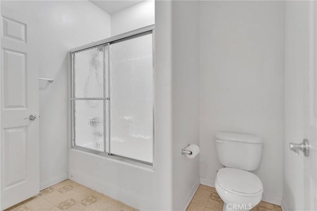 34113 Castle Pines Dr, Yucaipa, CA 92399 - full bathroom featuring toilet, enclosed tub / shower combo, and baseboards