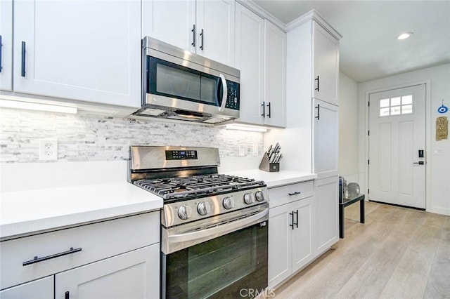 1053 Tiburon Way, San Luis Obispo, CA 93401 - kitchen with stainless steel appliances, light countertops, light wood-style floors, backsplash, and recessed lighting