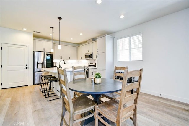 1053 Tiburon Way, San Luis Obispo, CA 93401 - dining space with light wood-type flooring, recessed lighting, and baseboards