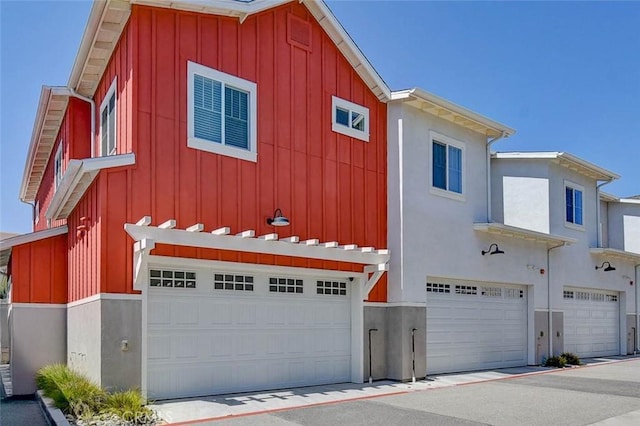 1053 Tiburon Way, San Luis Obispo, CA 93401 - view of front of house featuring board and batten siding and an attached garage