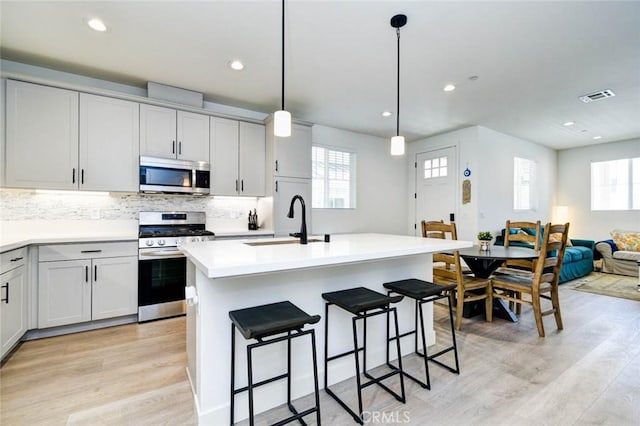 1053 Tiburon Way, San Luis Obispo, CA 93401 - kitchen with stainless steel appliances, a sink, plenty of natural light, light wood-style flooring, and recessed lighting
