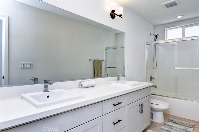 1053 Tiburon Way, San Luis Obispo, CA 93401 - bathroom featuring double vanity, toilet, bath / shower combo with glass door, tile patterned floors, and recessed lighting