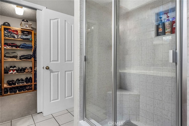 1729 Amelia Ave, San Pedro, CA 90731 - bathroom featuring a shower stall, a walk in closet, and tile patterned flooring