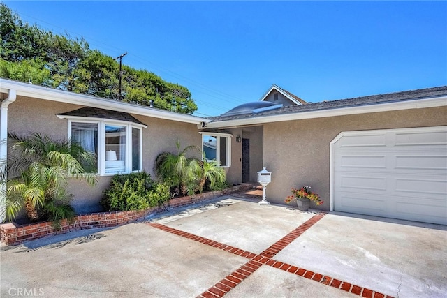 1729 Amelia Ave, San Pedro, CA 90731 - view of front of house featuring stucco siding, a garage, and concrete driveway