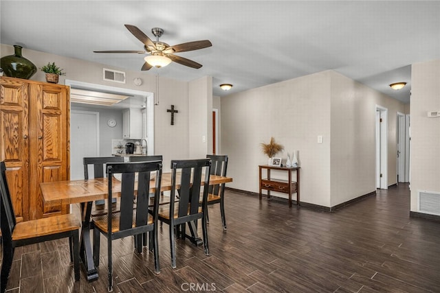 1729 Amelia Ave, San Pedro, CA 90731 - dining area featuring dark wood-style flooring, a ceiling fan, and baseboards