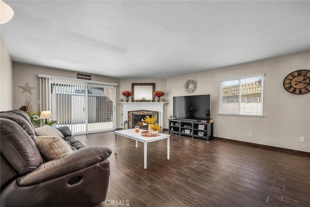 1729 Amelia Ave, San Pedro, CA 90731 - living area featuring wood finished floors, a lit fireplace, and baseboards