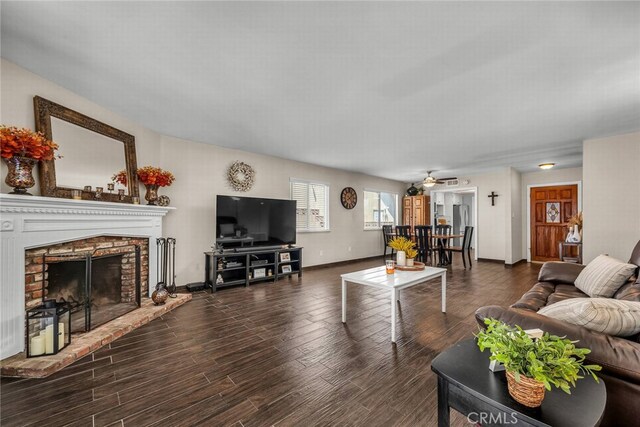 1729 Amelia Ave, San Pedro, CA 90731 - living area featuring dark wood-style floors, ceiling fan, a brick fireplace, and baseboards