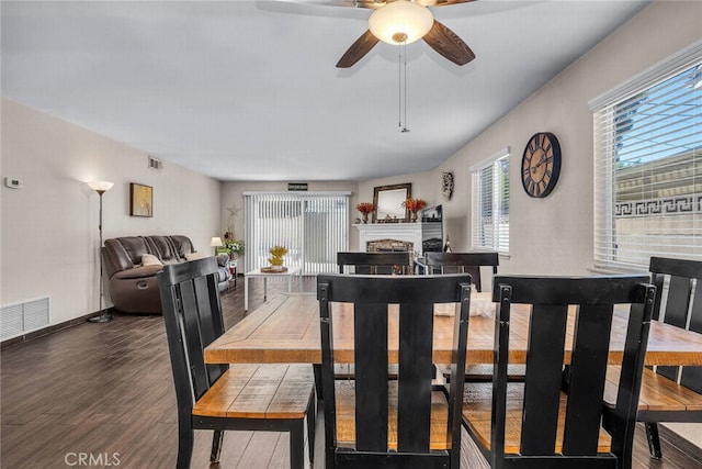 1729 Amelia Ave, San Pedro, CA 90731 - dining room featuring wood finished floors, a fireplace, and ceiling fan