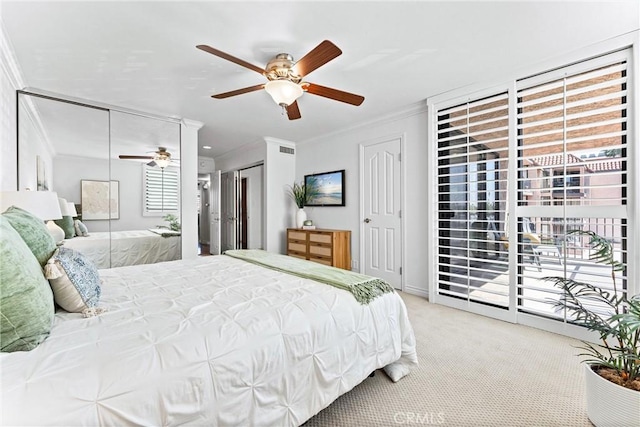 201 Bay Shore Ave Unit 209, Long Beach, CA 90803 - bedroom with ornamental molding, light colored carpet, access to exterior, a ceiling fan, and multiple closets