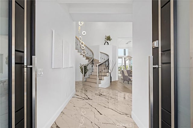 28 Brownsbury Rd, Laguna Niguel, CA 92677 - entrance foyer with baseboards, stairway, and marble tiled floors