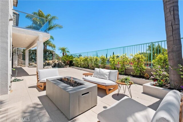 28 Brownsbury Rd, Laguna Niguel, CA 92677 - view of patio / terrace with an outdoor living space with a fire pit, a fenced backyard, and a water view