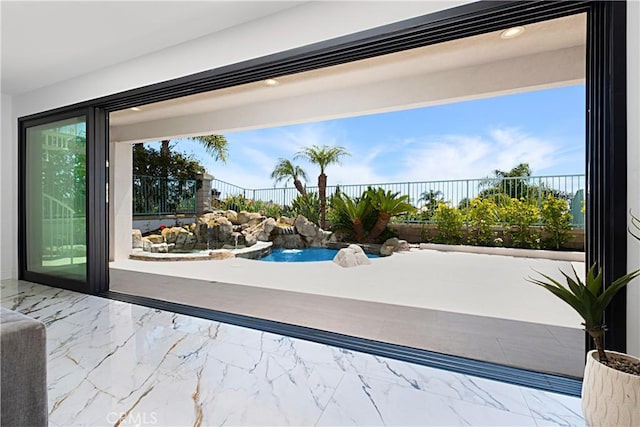 28 Brownsbury Rd, Laguna Niguel, CA 92677 - doorway to outside with marble look tiles and plenty of natural light