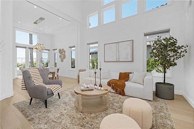 28 Brownsbury Rd, Laguna Niguel, CA 92677 - living area featuring a towering ceiling, light wood-style flooring, baseboards, and recessed lighting
