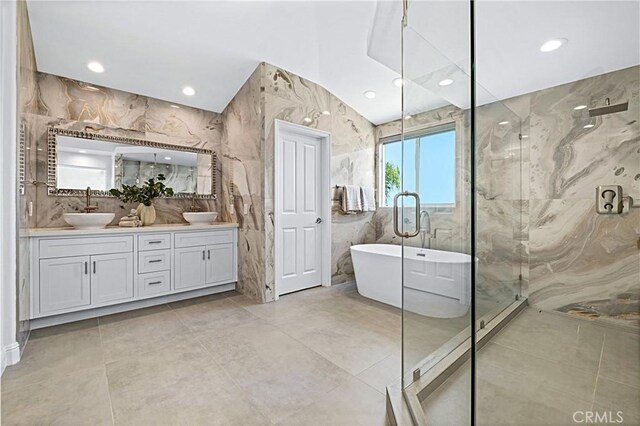 28 Brownsbury Rd, Laguna Niguel, CA 92677 - bathroom with a shower stall, double vanity, a freestanding bath, and recessed lighting