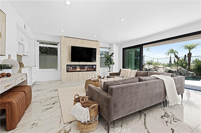 28 Brownsbury Rd, Laguna Niguel, CA 92677 - living room featuring recessed lighting, light marble finish flooring, and a fireplace