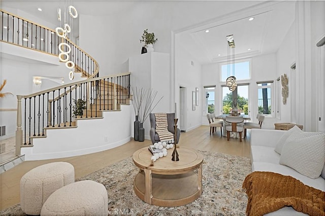 28 Brownsbury Rd, Laguna Niguel, CA 92677 - living room with a high ceiling, wood finished floors, stairway, recessed lighting, and baseboards