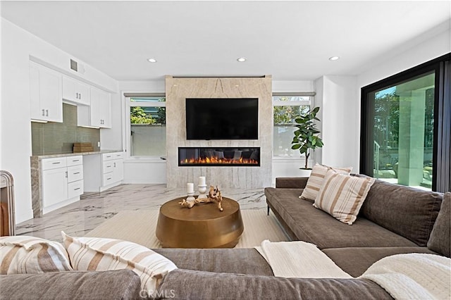 28 Brownsbury Rd, Laguna Niguel, CA 92677 - living area featuring light marble finish flooring, recessed lighting, and a tile fireplace