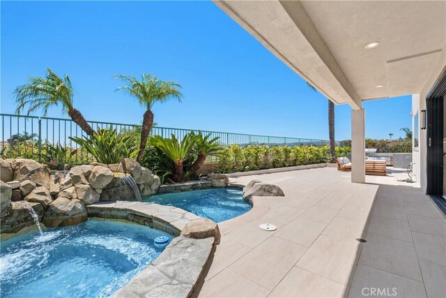 28 Brownsbury Rd, Laguna Niguel, CA 92677 - view of pool featuring a patio area, a fenced backyard, and a pool with connected hot tub
