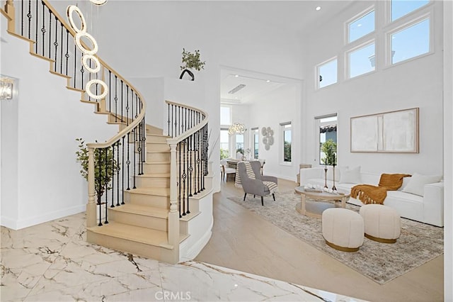28 Brownsbury Rd, Laguna Niguel, CA 92677 - staircase with a high ceiling, healthy amount of natural light, baseboards, marble finish flooring, and recessed lighting
