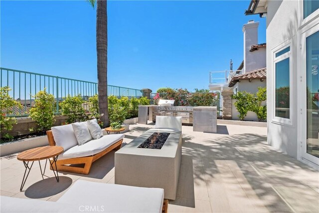 28 Brownsbury Rd, Laguna Niguel, CA 92677 - view of patio with exterior kitchen, an outdoor living space with a fire pit, fence, and grilling area