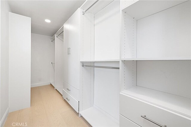 28 Brownsbury Rd, Laguna Niguel, CA 92677 - walk in closet with light wood-style flooring