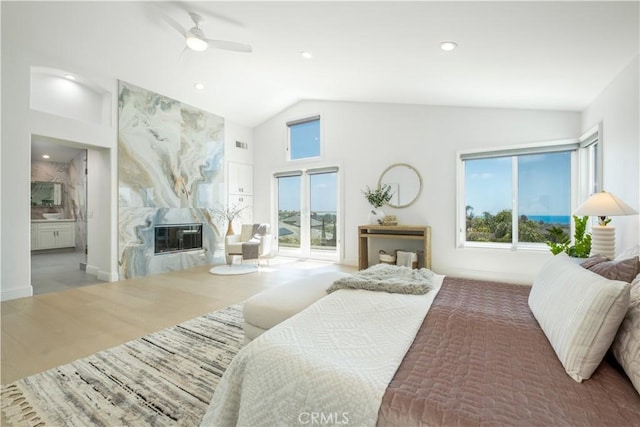 28 Brownsbury Rd, Laguna Niguel, CA 92677 - bedroom featuring vaulted ceiling, access to exterior, a high end fireplace, wood finished floors, and a ceiling fan