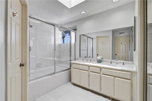 2146 Via Aguila, San Clemente, CA 92673 - full bathroom featuring tile patterned floors, a skylight, double vanity, and recessed lighting